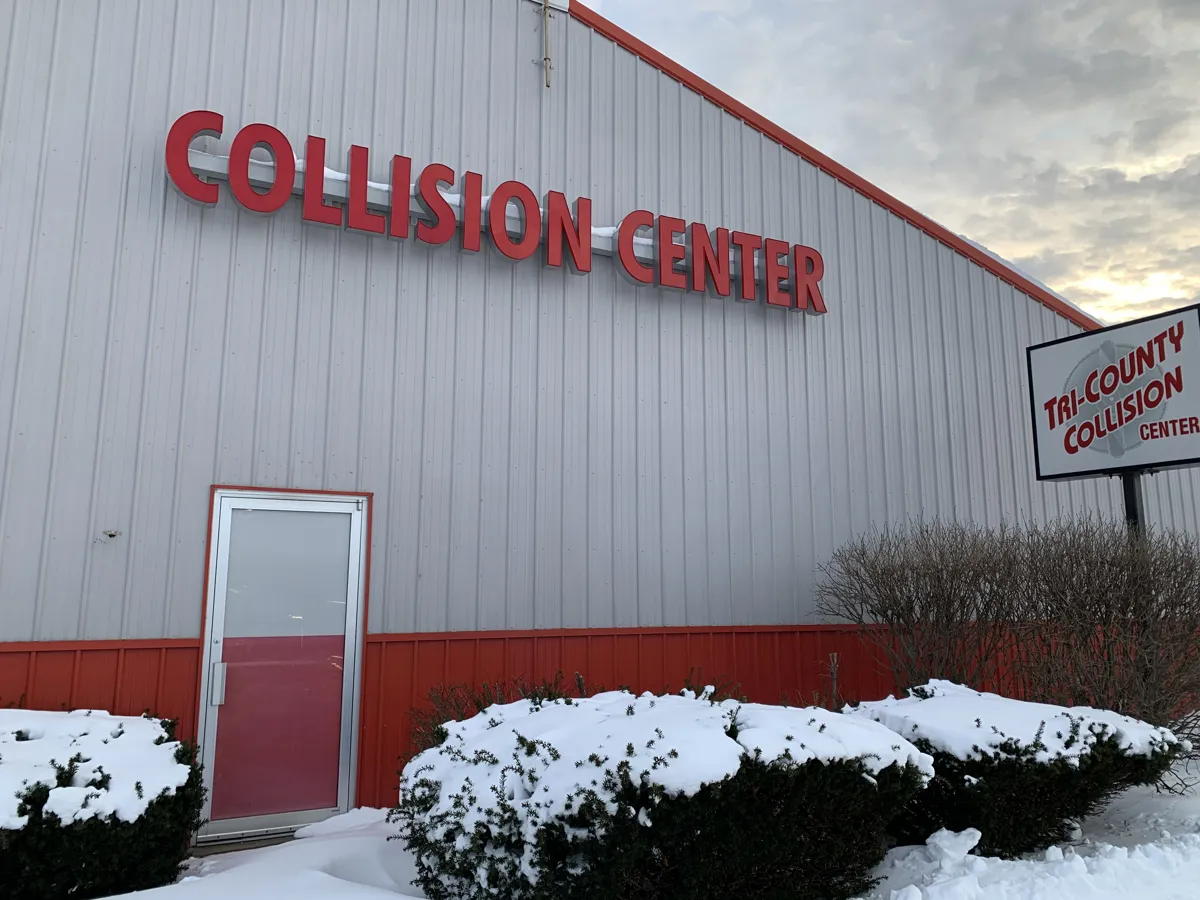 Mike's Tri County Collision shop exterior in winter